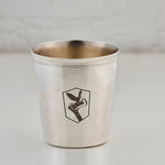Silver cup with an engraved logo on a light gray background