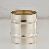 Silver cup on a light gray background